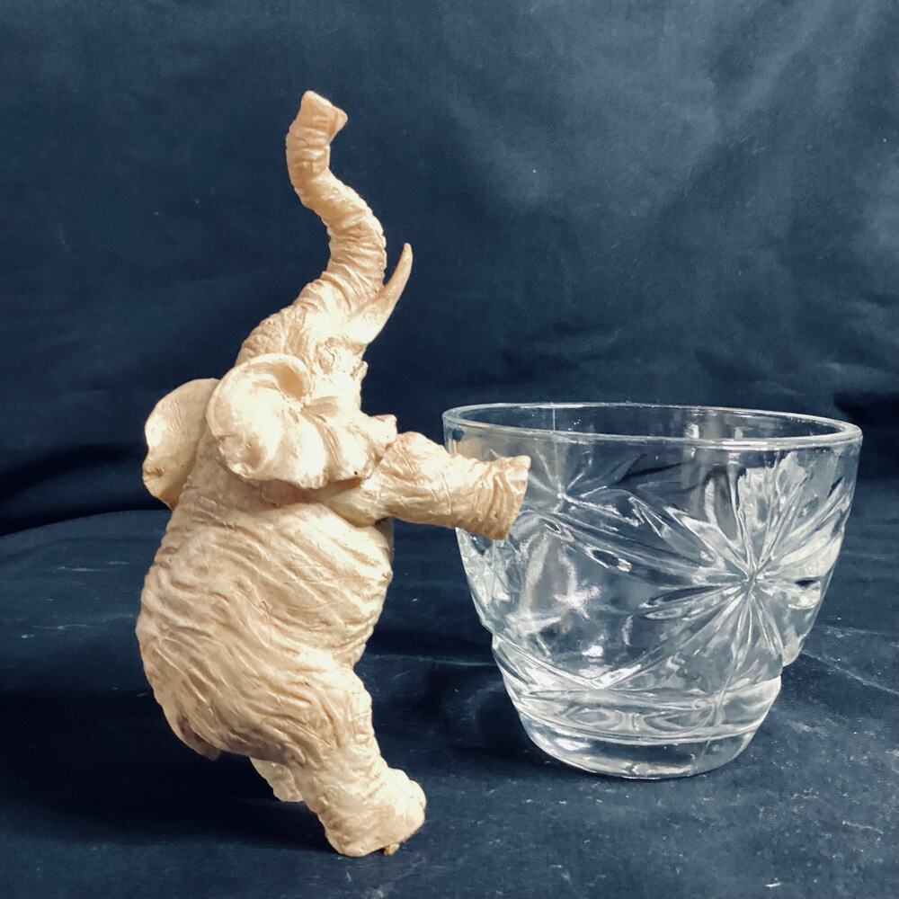 Fun Leaning Elephant Figurine